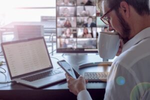 Male healthcare provider (HCP) attending a virtual meeting